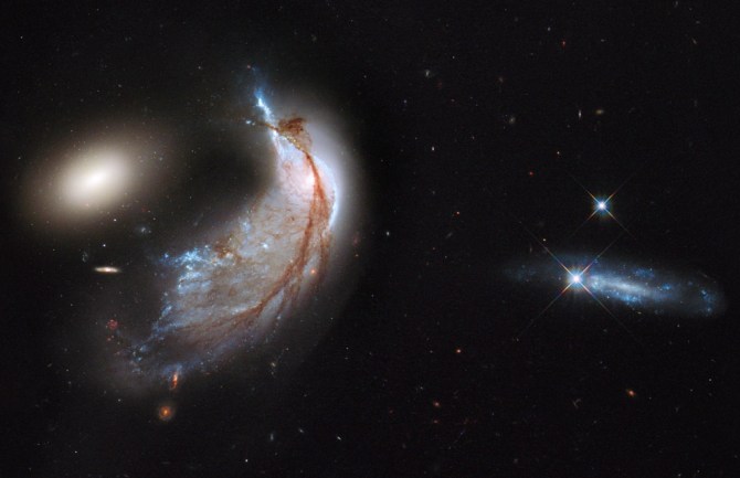 The cosmos dynamic and, in many cases, violent. This image of Arp 142 shows a collision between galaxies. The culprit: gravity.
